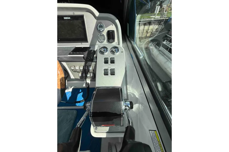 Slide: The Image of Control panel of a 2007 Formula 27 Performance Cruiser with gauges and switches. - 12