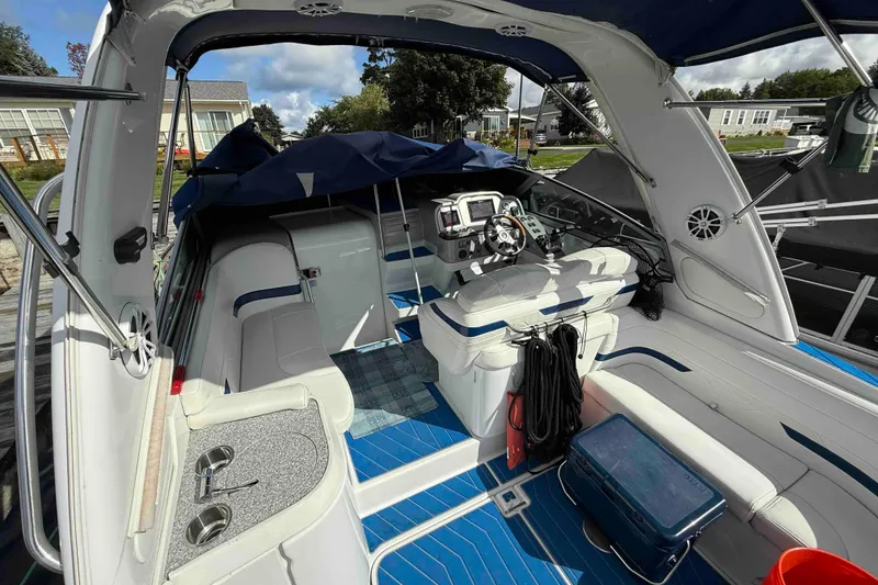 Slide: The Image of 2007 Formula 27 Performance Cruiser interior with blue flooring and modern cockpit design. - 13