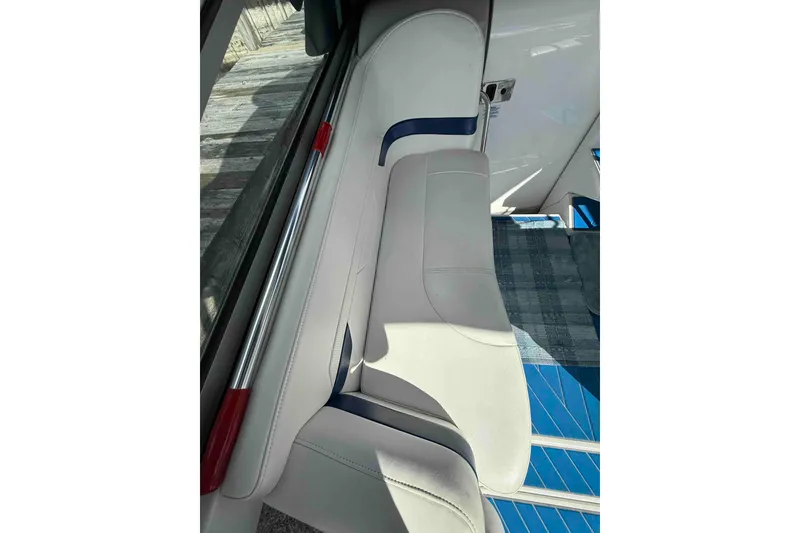 Slide: The Image of 2007 Formula 27 Performance Cruiser interior seating with white upholstery and blue accents. - 14