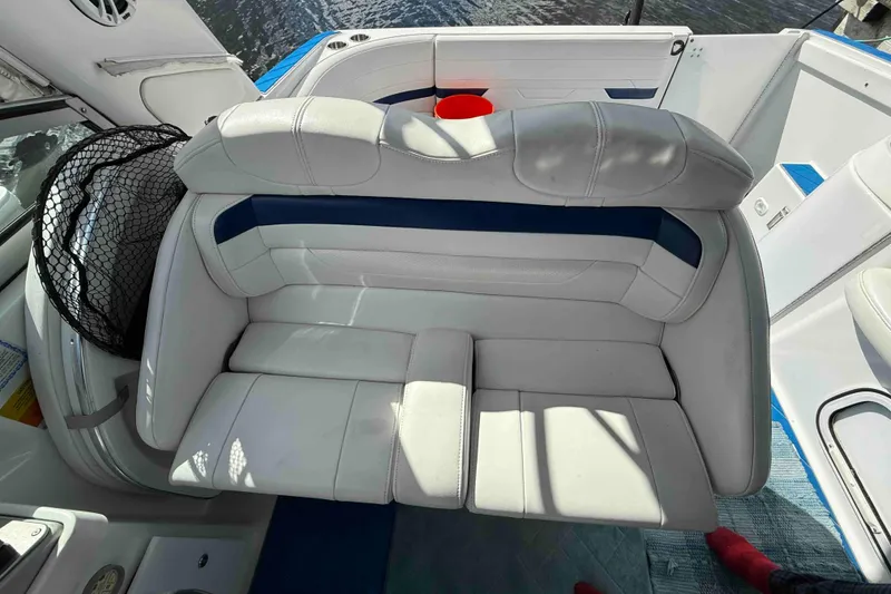 Slide: The Image of 2007 Formula 27 Performance Cruiser interior with white leather seating and blue accents. - 16