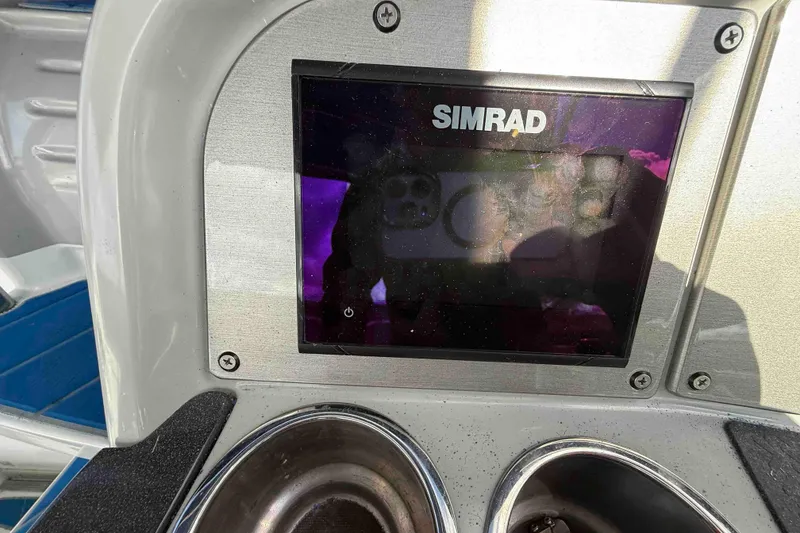 Slide: The Image of Simrad display on 2007 Formula 27 Performance Cruiser dashboard, with cup holders. - 24