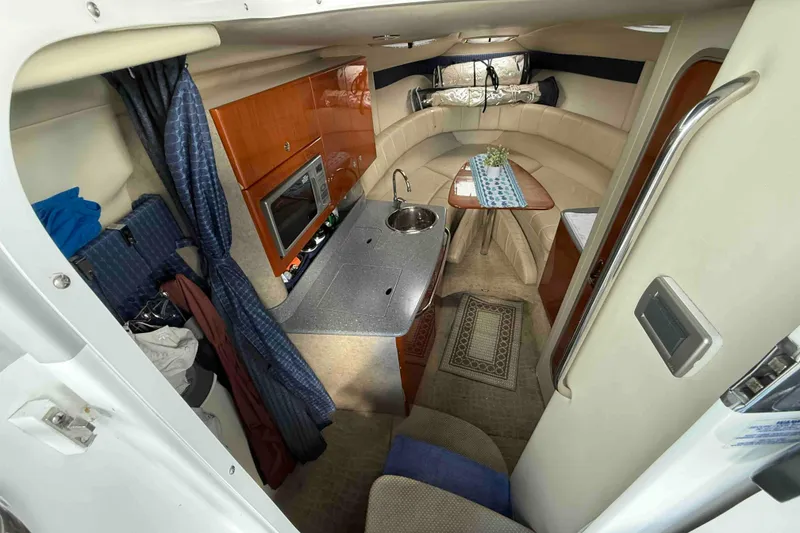 Slide: The Image of Interior of 2007 Formula 27 Performance Cruiser with kitchenette and seating area. - 26
