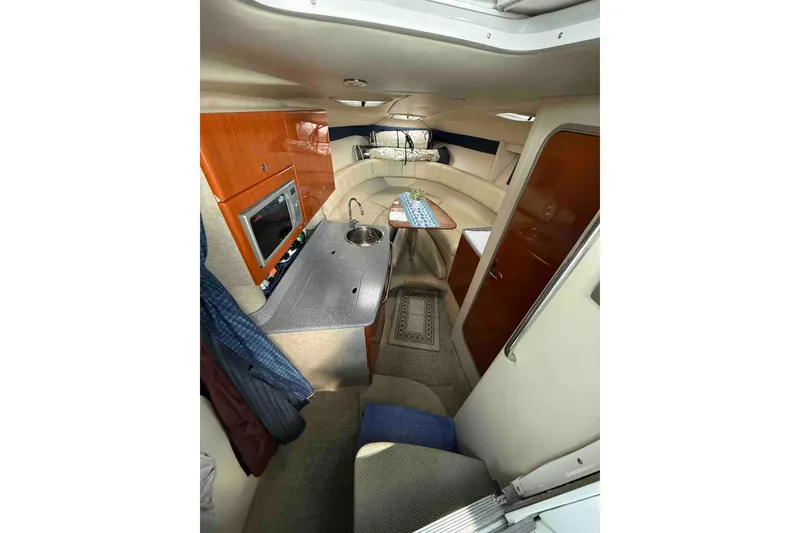 Slide: The Image of Interior of 2007 Formula 27 Performance Cruiser with kitchenette and seating area. - 27