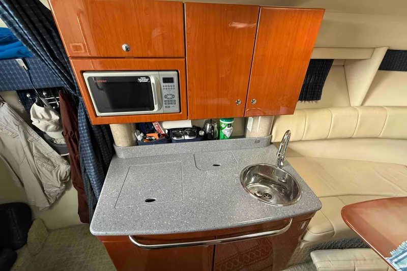 Slide: The Image of 2007 Formula 27 Performance Cruiser interior with kitchenette, microwave, and sink. - 28