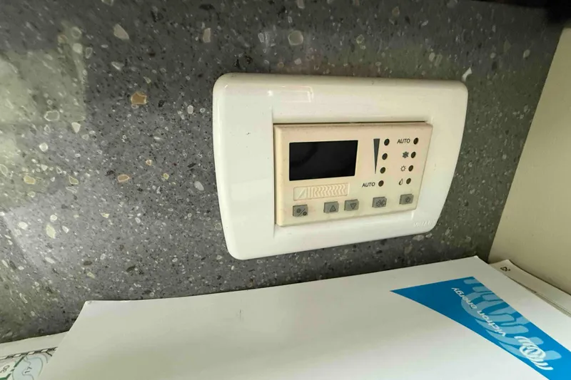 Slide: The Image of Control panel on a 2007 Formula 27 Performance Cruiser, mounted on a speckled countertop. - 33