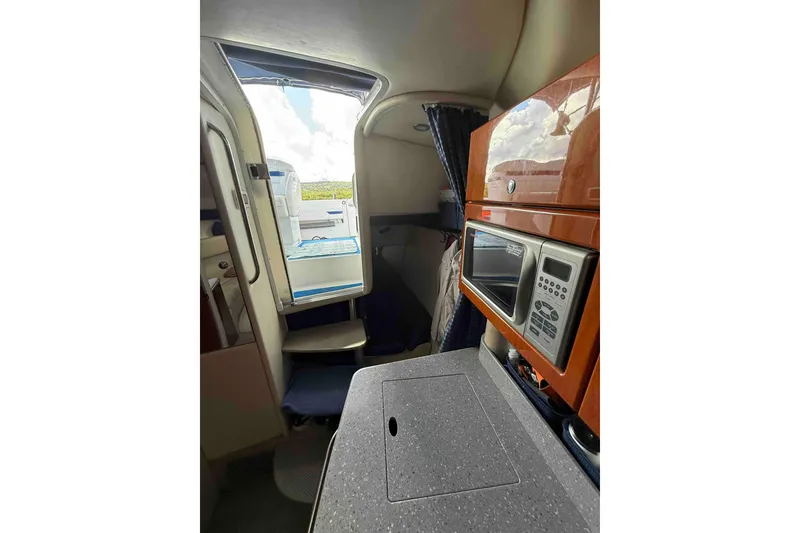 Slide: The Image of Interior of 2007 Formula 27 Performance Cruiser with kitchenette and open cabin door. - 34