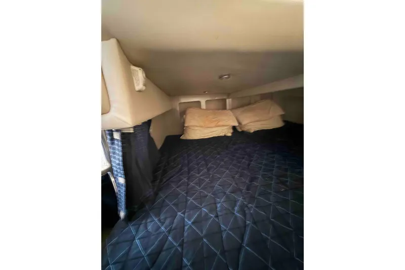 Slide: The Image of Interior cabin of 2007 Formula 27 Performance Cruiser with bed and pillows. - 44