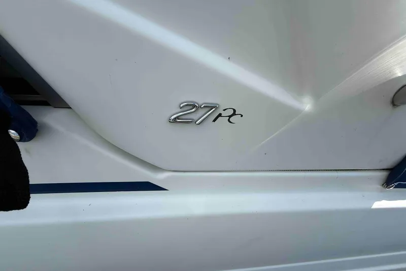 Slide: The Image of 2007 Formula 27 Performance Cruiser emblem on white boat exterior. - 59