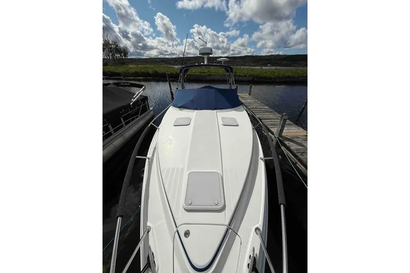 Slide: The Image of 2007 Formula 27 Performance Cruiser docked under a cloudy sky. - 8