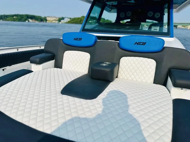 Slide: The Image of Luxurious seating on 2025 HCB 48 Campeon boat with quilted upholstery. - 11