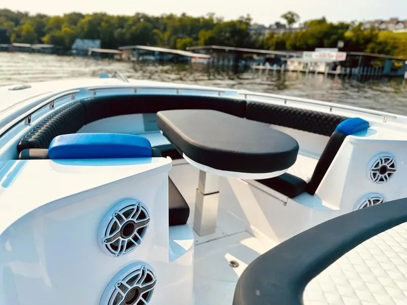 Slide: The Image of Luxurious seating area on 2025 HCB 48 Campeon boat with scenic water view. - 12