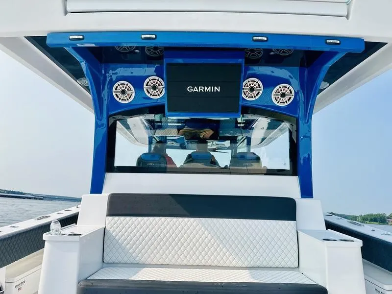 Slide: The Image of 2025 HCB 48 Campeon boat interior with Garmin system and seating. - 14