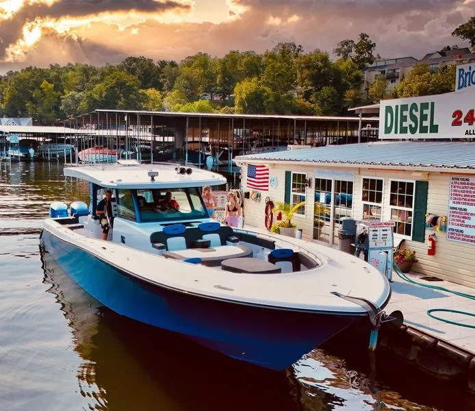 Slide: The Image of 2025 HCB 48 Campeon boat docked at marina under dramatic sky. - 17