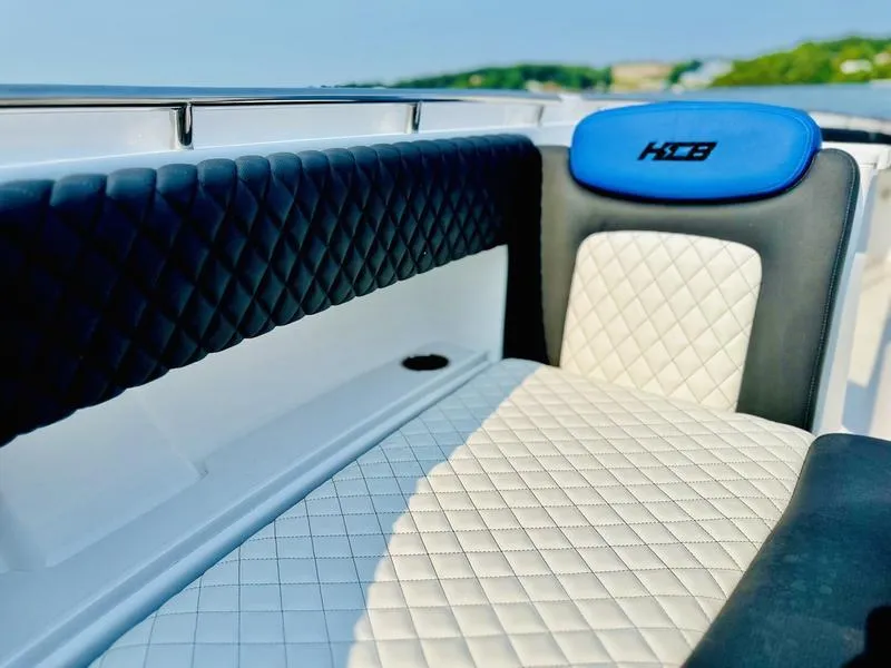Slide: The Image of Luxurious seating on 2025 HCB 48 Campeon boat with quilted upholstery. - 9
