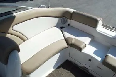Slide: The Image of 2011 Yamaha Boats SX240 HO interior seating with beige and white upholstery. - 10