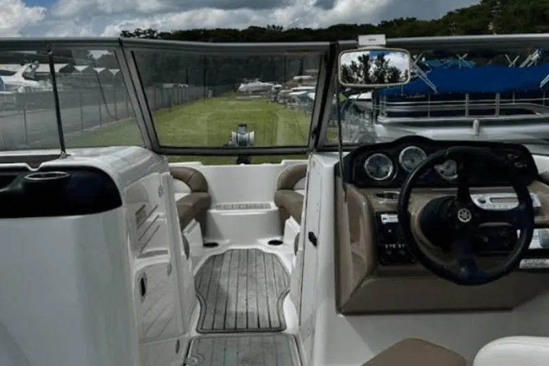 Slide: The Image of 2011 Yamaha Boats SX240 HO interior with steering wheel and seating area. - 7