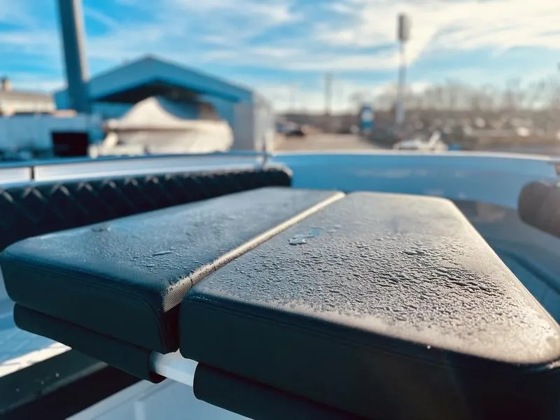 Slide: The Image of Close-up of the 2024 HCB 42 Lujo boat seat with morning dew. - 10