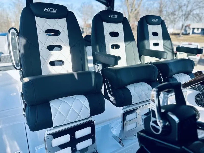 Slide: The Image of 2024 HCB 42 Lujo boat seats with black and white upholstery. - 12