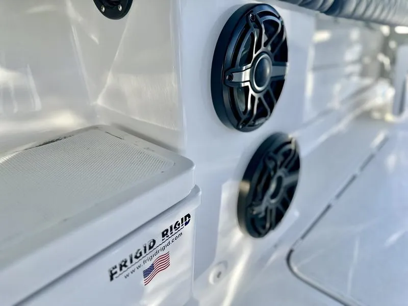 Slide: The Image of Close-up of 2024 HCB 42 Lujo boat interior with Frigid Rigid cooler and speakers. - 13
