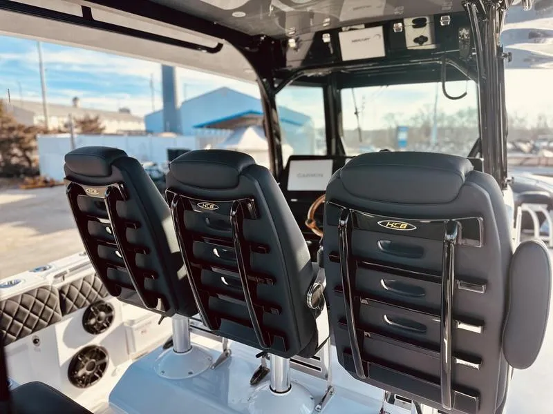 Slide: The Image of 2024 HCB 42 Lujo boat interior with black leather seats. - 14