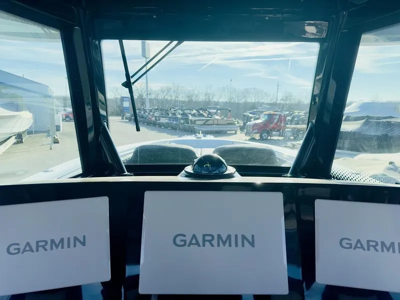 Slide: The Image of Cockpit view of 2024 HCB 42 Lujo with Garmin navigation screens. - 18