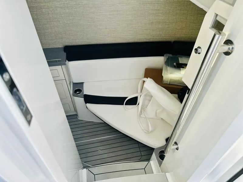 Slide: The Image of 2024 HCB 42 Lujo cabin interior with seating and storage. - 19