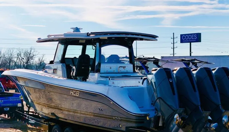 Slide: The Image of 2024 HCB 42 Lujo boat with multiple outboard engines on display. - 2