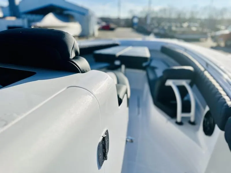 Slide: The Image of 2024 HCB 42 Lujo luxury boat interior with black seating and sleek design. - 7