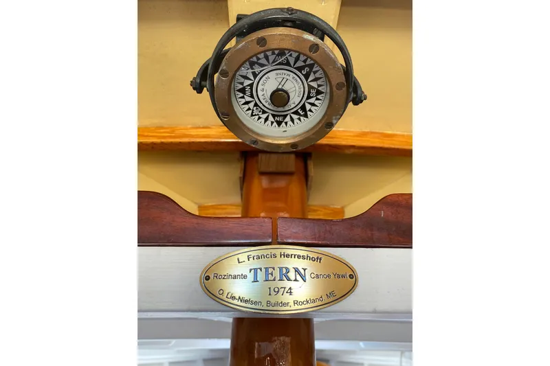 Slide: The Image of Compass and nameplate of 1974 Herreshoff Rozinante canoe yawl, built by O. Lie-Nielsen. - 78