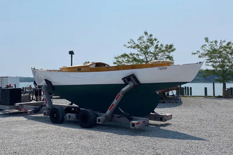 Slide: The Image of 1974 Herreshoff Rozinante sailboat on trailer, named "TERN," in a marina setting. - 27