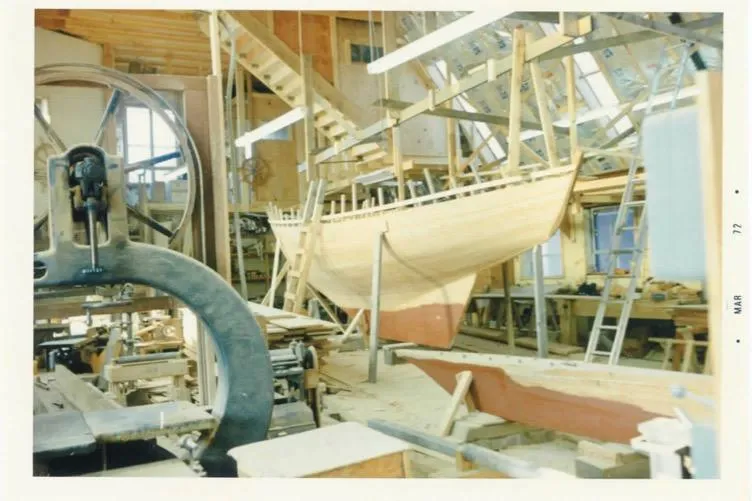 Slide: The Image of 1974 Herreshoff Rozinante sailboat under construction in a workshop. - 69