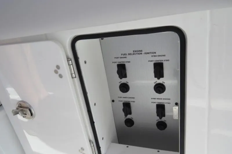 Slide: The Image of Control panel of 2024 HCB 53 FT Suenos boat, showing engine fuel selection and ignition switches. - 13