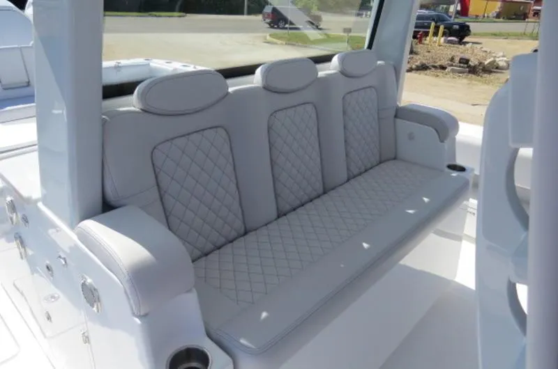 Slide: The Image of Luxurious seating on the 2024 HCB 53 FT Suenos boat, featuring quilted upholstery. - 15