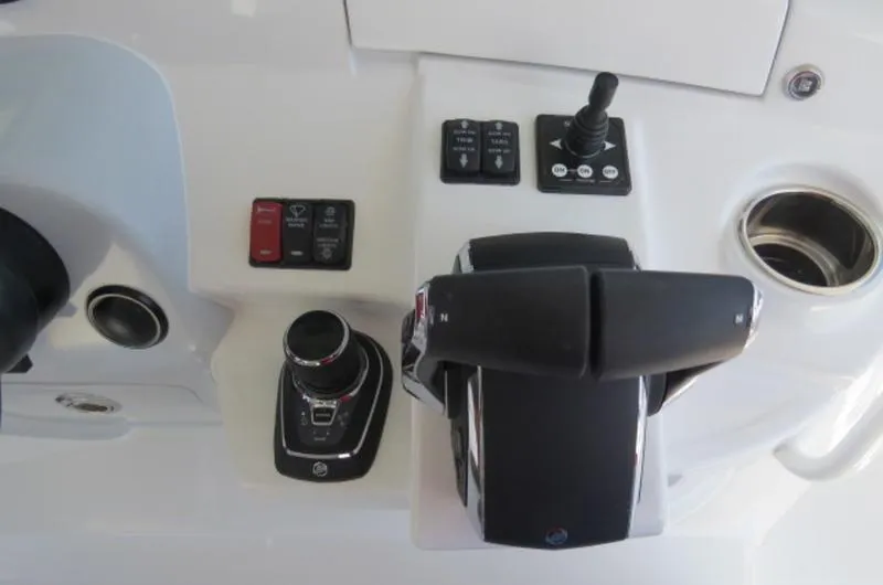 Slide: The Image of Control panel of 2024 HCB 53 FT Suenos boat with joystick and throttle. - 18