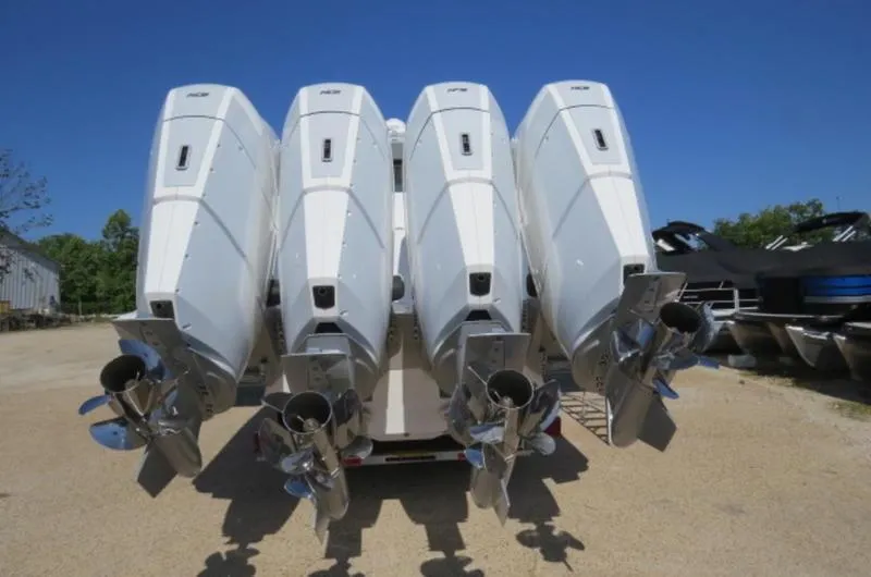 Slide: The Image of 2024 HCB 53 FT Suenos boat with four powerful outboard engines. - 2