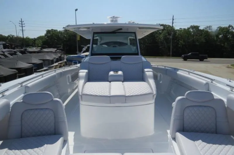 Slide: The Image of 2024 HCB 53 FT Suenos boat with luxurious seating and sleek design. - 21