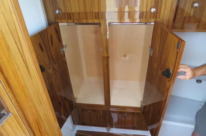 Slide: The Image of 2024 HCB 53 FT Suenos interior with open wooden cabinets. - 28