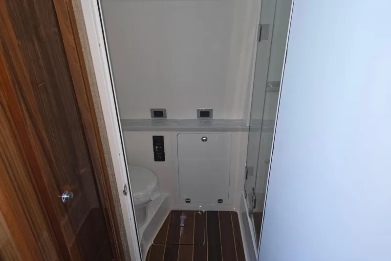 Slide: The Image of 2024 HCB 53 FT Suenos yacht bathroom with modern fixtures and wooden flooring. - 37