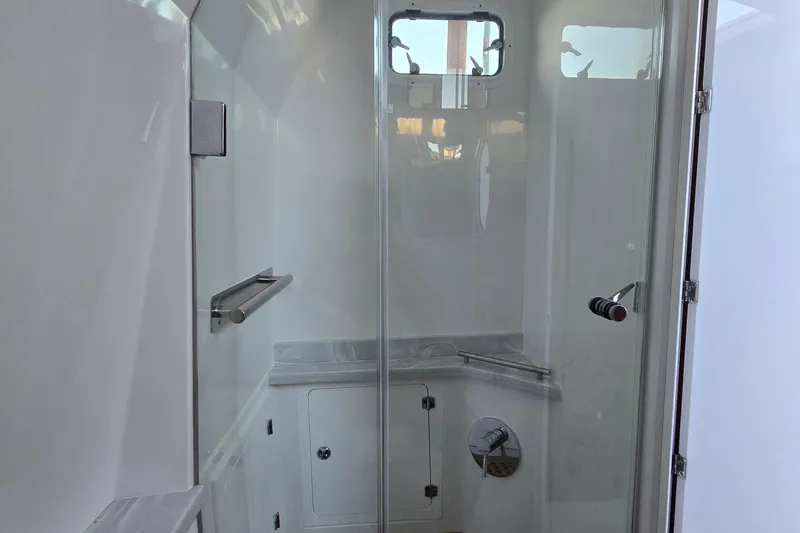 Slide: The Image of Interior of 2024 HCB 53 FT Suenos boat bathroom with modern fixtures. - 38