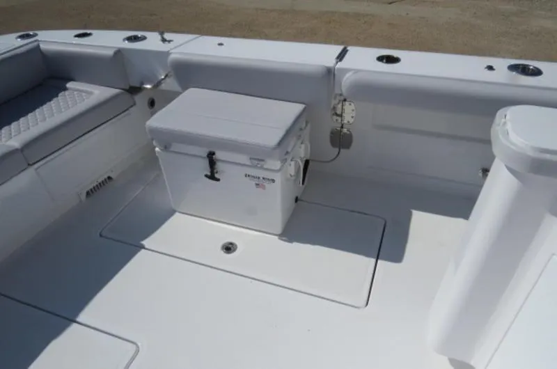 Slide: The Image of 2024 HCB 53 FT Suenos boat deck with seating and cooler. - 4