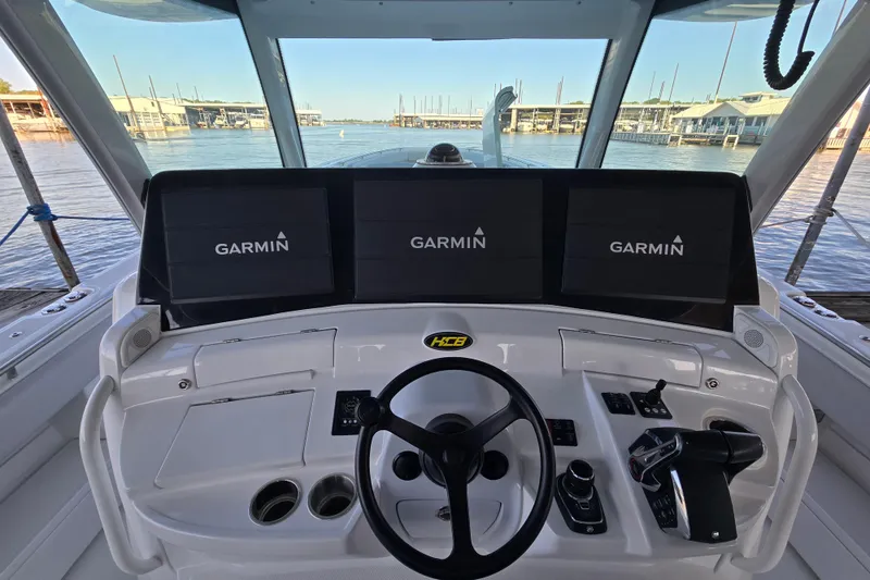 Slide: The Image of Helm of 2024 HCB 53 FT Suenos with Garmin displays, docked at marina. - 50
