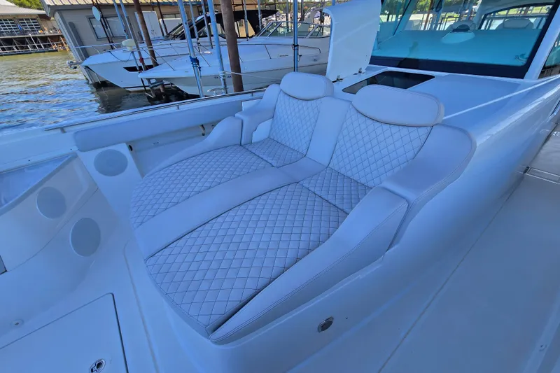 Slide: The Image of Luxurious seating on 2024 HCB 53 FT Suenos boat, featuring diamond-stitched upholstery. - 55