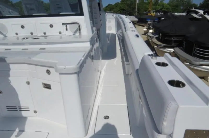 Slide: The Image of 2024 HCB 53 FT Suenos boat deck with sleek white design and modern amenities. - 9