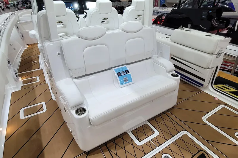 Slide: The Image of Luxurious seating on 2023 HCB 39 FT Speciale boat with elegant white upholstery. - 12