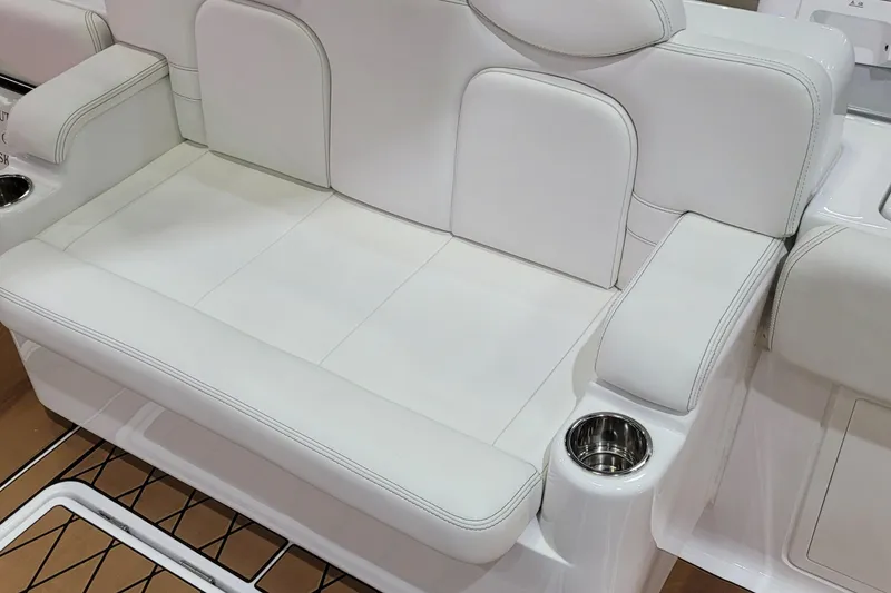 Slide: The Image of 2023 HCB 39 FT Speciale boat seating with white upholstery and built-in cup holders. - 14