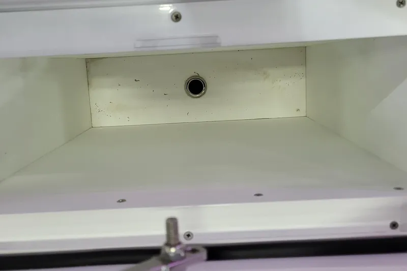 Slide: The Image of Storage compartment inside 2023 HCB 39 FT Speciale boat, featuring a clean, white interior. - 16