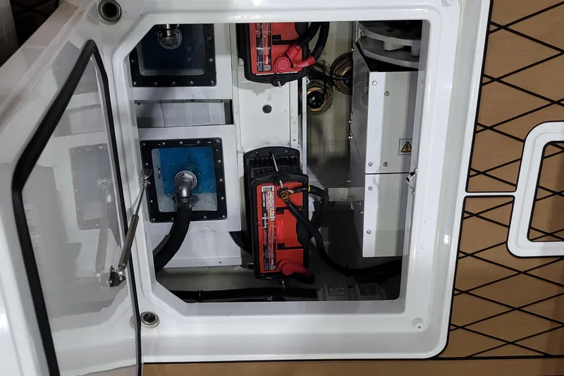 Slide: The Image of 2023 HCB 39 FT Speciale boat compartment with batteries and wiring. - 18