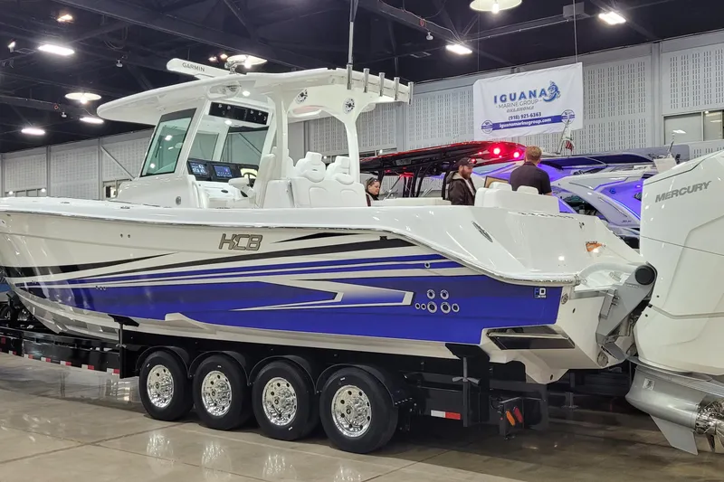 Slide: The Image of 2023 HCB 39 FT Speciale boat displayed indoors on a trailer. - 2