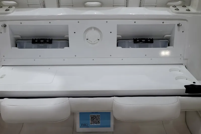 Slide: The Image of 2023 HCB 39 FT Speciale boat interior storage compartment with white seating. - 25