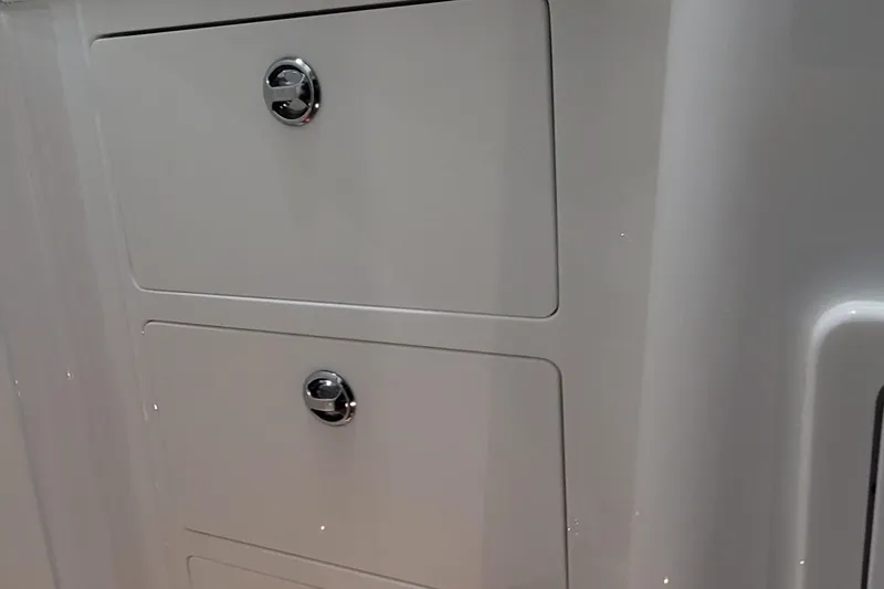 Slide: The Image of 2023 HCB 39 FT Speciale boat storage compartments with sleek design and chrome handles. - 27